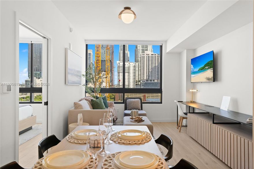 The District is Downtown Miami’s newest residential concept, offering a modern hybrid ownership model designed for today’s urban lifestyle. This fully furnished development features studio, one- and two-bedroom residences with premium Italian cabinetry, high-end appliances, and designer finishes throughout.

Residences include smart-home technology, integrated lighting, audio and window treatments, washer/dryer, and thoughtfully curated interiors by Meshberg Group. Floor-to-ceiling windows provide abundant natural light and city views.

The building offers over 25,000 square feet of amenities, including a rooftop pool deck with skyline views, fitness center with yoga studio, co-working spaces, indoor basketball and racquetball courts, private meeting rooms, and curated social areas.

Residents benefit from hotel-style services such as 24-hour security, valet, concierge, housekeeping, and on-site dining options. Ideally located in the heart of Downtown Miami, The District provides immediate access to Brickell, Miami Worldcenter, dining, shopping, and entertainment.

Ideal for investors and end-users seeking flexibility, design, and a vibrant Miami lifestyle.  ?