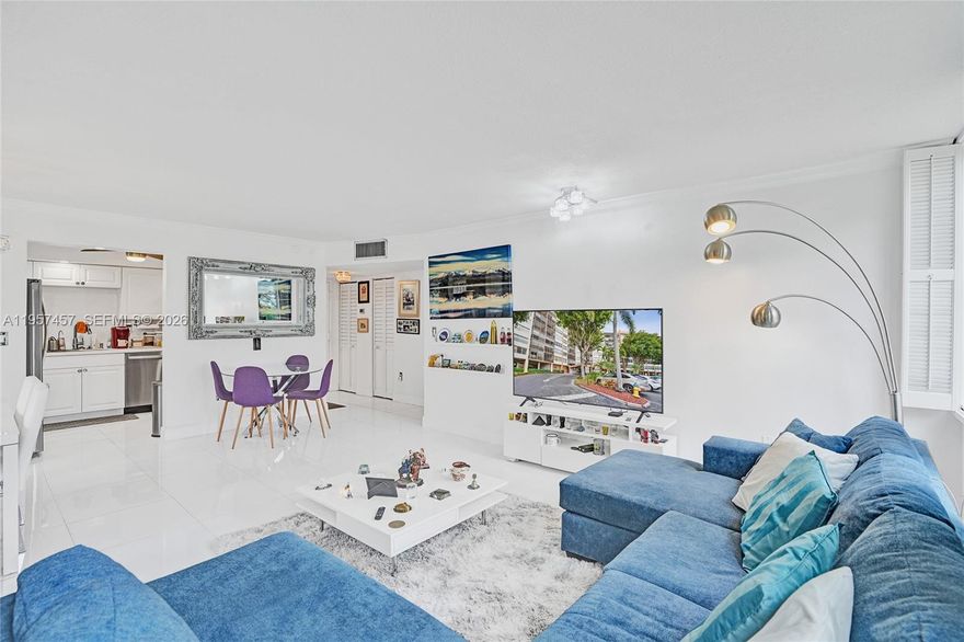 A stunning, fully renovated corner-unit condo featuring serene garden and golf course views from every window. This bright 2-bedroom, 2-bath residence is impeccably maintained and offers abundant closet space. The kitchen boasts quartz countertops and backsplash, along with brand-new stainless steel appliances. The spacious primary suite includes a generous walk-in closet. Enjoy the large screened balcony with breathtaking views. Tile flooring throughout enhances the light-filled interior. Residents enjoy exceptional amenities including golf course access, clubhouse, pools, tennis courts, walking and biking paths, fitness classes, sauna, game rooms, free shuttle service, and security patrol. Ideally located near hospitals, shopping, dining, and supermarkets. HOA covers internet, cable, water, and trash.