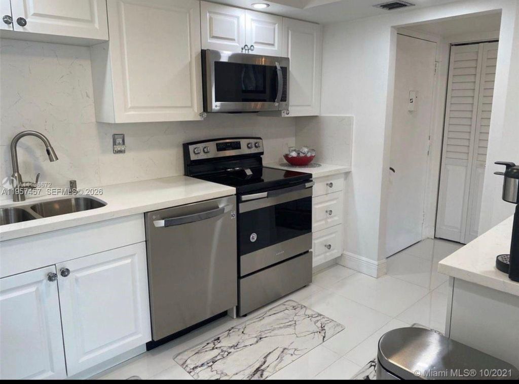 Photo of 1400 Saint Charles Pl #204, Pembroke Pines, FL 33026 (MLS # A11957457)