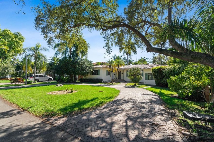 MOTIVATED SELLER! Please feel free to bring your OFFER. A Gem in MIAMI SHORES Location, Location, Location! WALK TO Biscayne Bay, 3/3 split. Picture windows throughout the house provide ample natural light throughout the day. Most beautiful and peaceful cul-de-sac streets. Updated impact hurricane windows, open layout, updated kitchen, bathroom, fireplace, new Porcelanosa and wood floors, circular driveways & formal entry. Storage room, Utility room/Laundry. Built in closed cabinetry, fireplace, and French doors. COMPLEMENTARY MEMBERSHIP to Miami Shores Country Club and Miami Shores Recreational Center. Take your morning walks and watch the evening SUNSET by Miami Shores Bay at the end of the street... by appointment.
 .