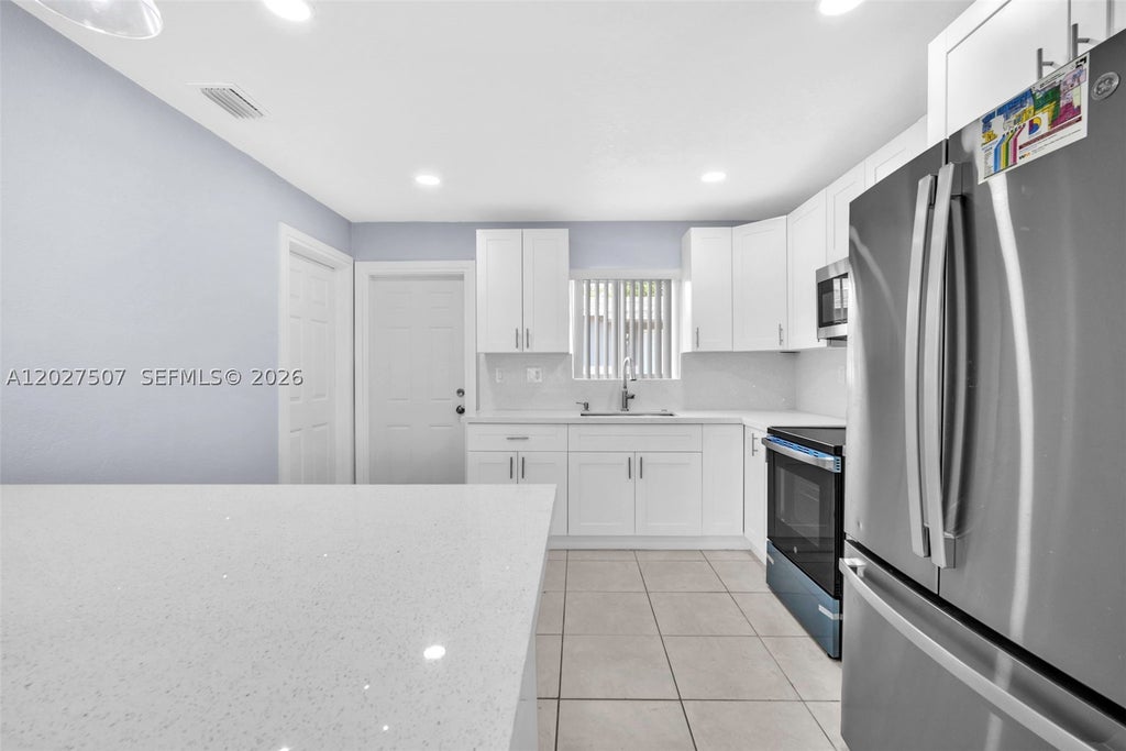 Photo of 367 Phippen Waiters Rd #back, Dania Beach, FL 33004 (MLS # A12027507)