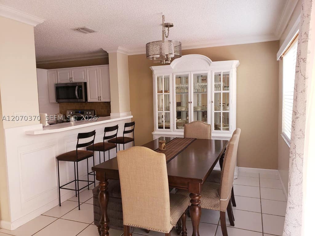 Photo of 223 SW Maple Ter, Davie, FL 33325 (MLS # A12070370)