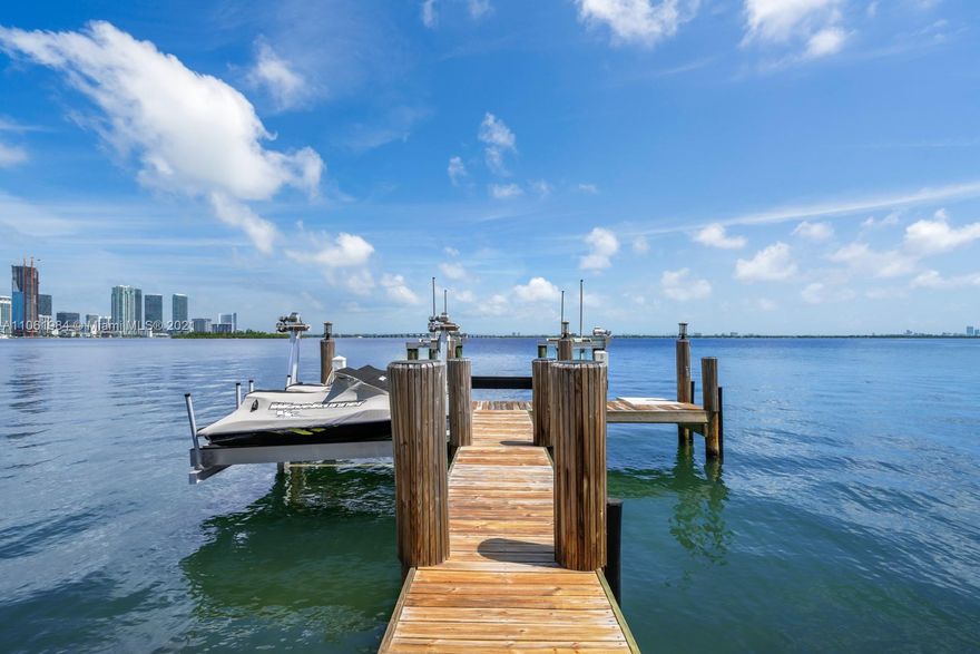 Stunning waterfront estate located on Biscayne Island with dramatic wide bay views. Completely renovated four bed, four and half bath home with top-of-the-line finishes throughout including Subzero kitchen appliances and marble countertops. Bright and airy open floor plan with lofted ceilings in the living and dining room. Breathtaking sunset views of the Edgewater city skyline make this the perfect Miami home. Covered summer kitchen and dining area with pool and bay views. Oversize 13,400 sq foot lot with over 100 feet of waterfrontage.