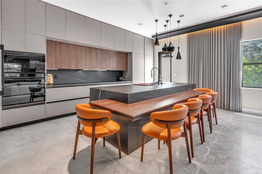 PICTURES ARE REAL! Luxury & comfort meet in this stunning 5BR/4.5BA estate, fully customized with considerable investment in premium finishes. Features 1 Studio room with full bath, 1st floor with inside/outside entry. Purchased pre-construction 2 years ago, this home features soaring ceilings, open-concept layout, & a chef’s kitchen with top-tier appliances and custom cabinetry. The spa-like owner’s suite offers a walk-in shower, dual walk-in closets and dual vanities. Flooded by natural light, each space was designed for both elegance & functionality. 2car garage converted to family room and expanded paved driveway allows 4 cars, expansive tiled patio, and a prime Miami-Broward location close to shopping, dining, top schools, & major highways. This is not just a home — it’s a statement.