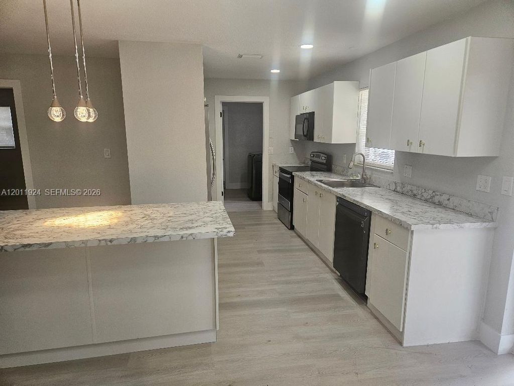 Photo of 1761 NW 26th Ter, Fort Lauderdale, FL 33311 (MLS # A12011924)