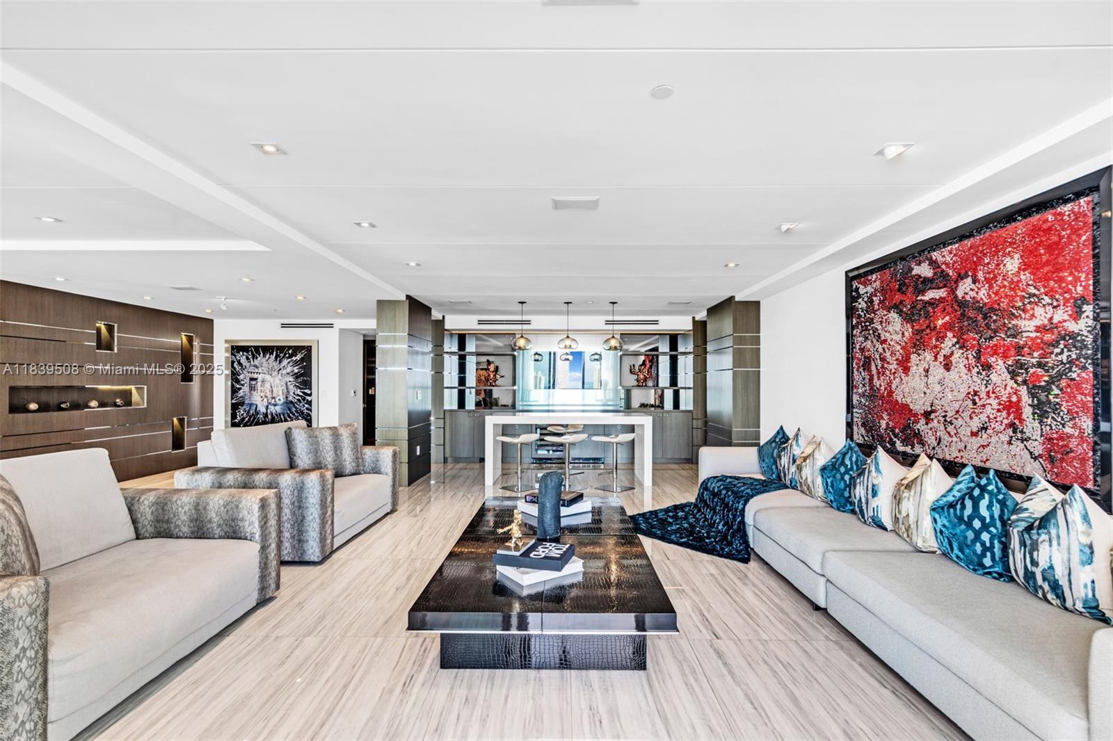 Presenting the coveted Penthouse at Peninsula II-an extraordinary 5,887 sqft, two-story mansion in the sky!
Boasting 5 bedrooms & 4 private balconies with breathtaking eastern & western views. Interiors designed by a renowned designer, showcase custom Ornare cabinetry, a cutting-edge Crestron smart home system, and top-of-the-line Miele appliances. Entertain in style with an enclosed movie theater, elegant bar, and expansive living areas. The pris primary suite features two large walk in closets. Beyond the residence, Peninsula Il offers five-star resort-style amenities, including A full-service spa and wellness center, Heated resort-style pools, Tennis courts, a children's playroom & a dog park. Private yoga/Pilates studio, gym, 24-hour concierge, valet, and security.