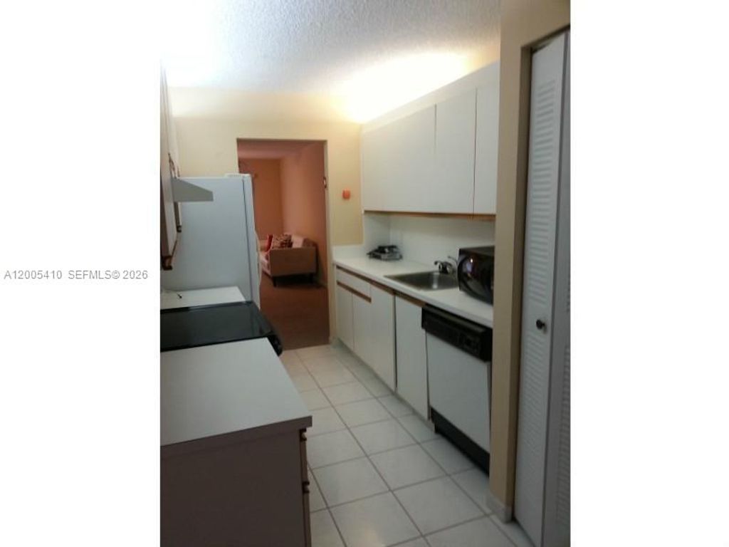 Photo of 12701 SW 13th St #202F, Pembroke Pines, FL 33027 (MLS # A12005410)