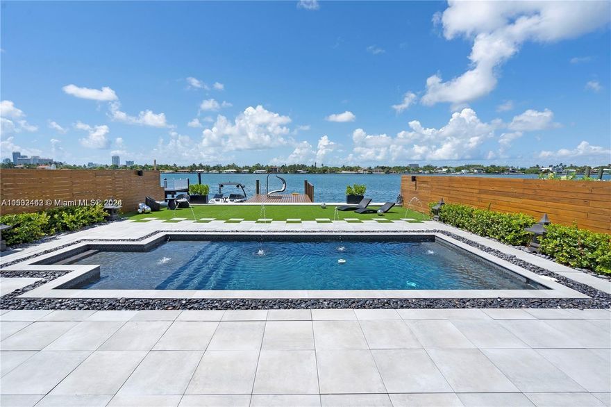 Welcome to 1480 Stillwater Dr! This fully renovated home in Miami Beach’s guard gated Stillwater features 3 bedrooms 2 and a half bathrooms and an open floorplan. A beautiful KOI fish pond surrounds floating steps upon entering the house. Enjoy wide open bay views from all living areas. This home has a modern kitchen, porcelain floors, steam shower, new dock and seawall, and generator. Live the true Miami Beach lifestyle with 50ft on the wide open bay.