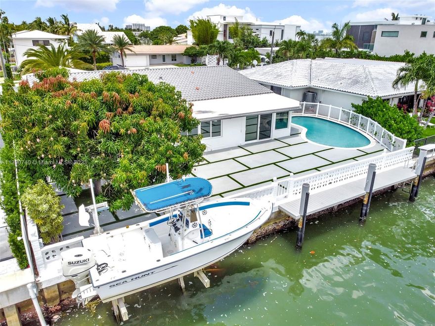This exclusive waterfront home in Miami's Upper East Side's Davis Harbor offers remarkable features. With 62 feet of water frontage on a wide canal, it provides breathtaking views and direct bay access. A recent renovation ensures a modern living space with high-impact proof doors and windows. The open floor plan maximizes natural light and offers beautiful canal views from every room. Additionally, it has great potential as a vacation home, generating maximum rental income. Currently rented for $12,000 per month, it demonstrates its desirability and investment value. In summary, this exclusive waterfront home combines stunning views, bay access, modern design, and rental income potential, making it an attractive choice for buyers or investors.