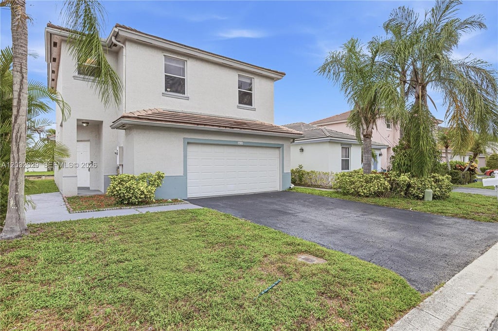 Photo of 6859 NW 69th Ct, Tamarac, FL 33321 (MLS # A12032029)