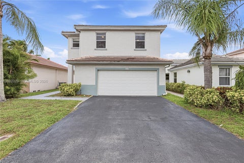Photo of 6859 NW 69th Ct, Tamarac, FL 33321 (MLS # A12032029)