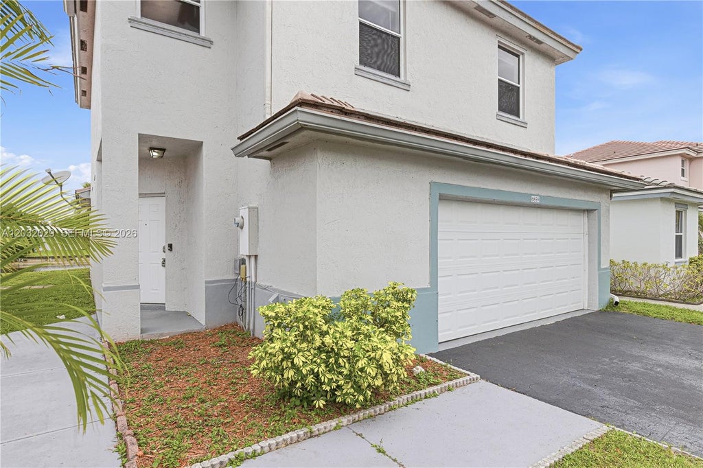 Photo of 6859 NW 69th Ct, Tamarac, FL 33321 (MLS # A12032029)