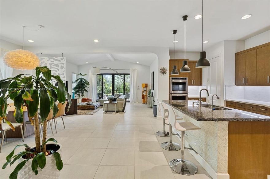 Stunning 3/2.5 home w/luxury accents in modern/gated community. Kitchen Aid SS apps, counter top stove, wall oven, large center aisle & contrasting quartz counters + large pantry w/wine cooler. Master has electronic window treatments & custom closets. Beautifully finished bath includes quartz counters, glass shower & jacuzzi. Powder room has accent wall & home has nice ceiling fixtures throughout. All bedrooms have custom closets & TV connections. Home has security system, laundry with tub, lanai with extended pavers & electronic shades. Garage has AC, tankless heater, electric charger, padded door with hurricane locks + cabinets & shelving. All windows high impact. This lovely home has large, hedged back yard (space for pool) is near I75, shops & restaurants. Community heated pool & gym.