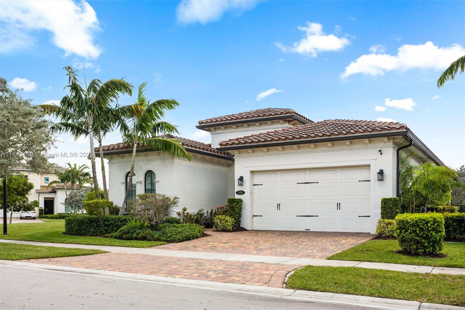 Stunning 3/2.5 home w/luxury accents in modern/gated community. Kitchen Aid SS apps, counter top stove, wall oven, large center aisle & contrasting quartz counters + large pantry w/wine cooler. Master has electronic window treatments & custom closets. Beautifully finished bath includes quartz counters, glass shower & jacuzzi. Powder room has accent wall & home has nice ceiling fixtures throughout. All bedrooms have custom closets & TV connections. Home has security system, laundry with tub, lanai with extended pavers & electronic shades. Garage has AC, tankless heater, electric charger, padded door with hurricane locks + cabinets & shelving. All windows high impact. This lovely home has large, hedged back yard (space for pool) is near I75, shops & restaurants. Community heated pool & gym.