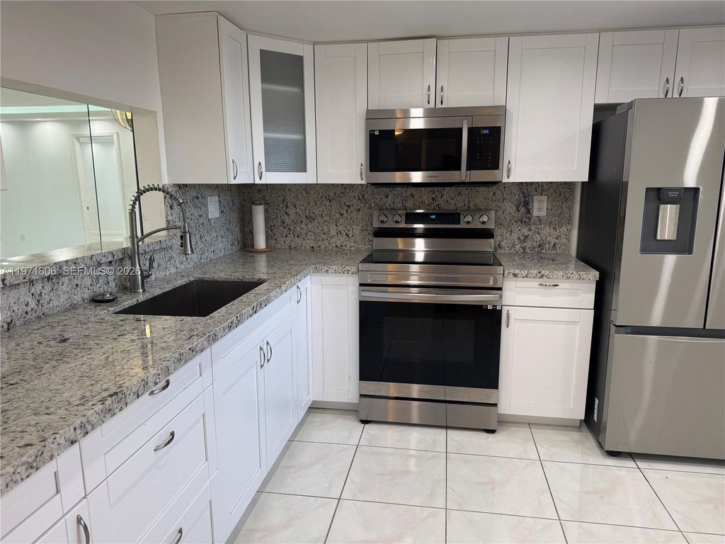 Photo of 1101 Colony Point Cir #102, Pembroke Pines, FL 33026 (MLS # A11971806)