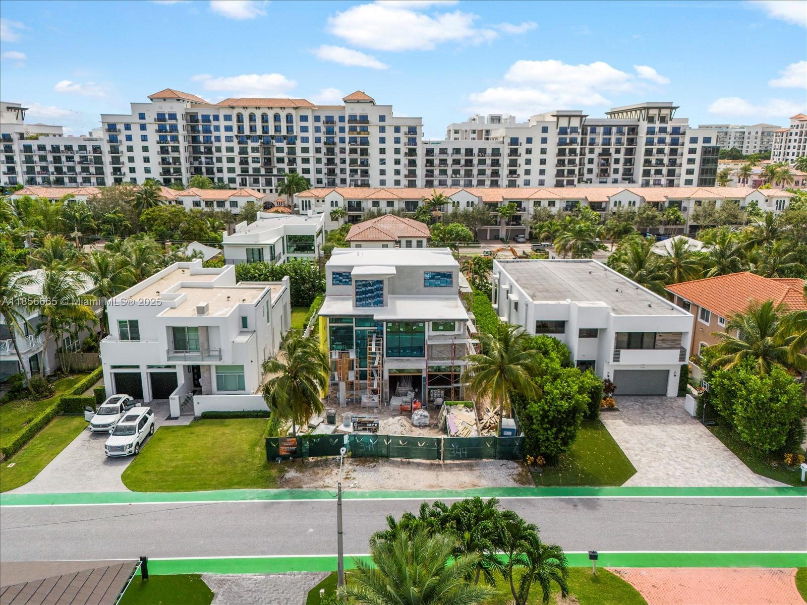 This exceptional, brand-new three-story estate by Yacov Development Group sets the standard for modern luxury in Boca Villas. Thoughtfully designed, the home offers exquisite elegance at every turn. The state-of-the-art chef’s kitchen is a culinary masterpiece, while five lavish bedrooms, six full bathrooms, and one half bath provide impeccable comfort. The primary suite features a private balcony and dual walk-in closets. An upstairs loft offers a serene space for relaxation. The third floor boasts an impressive clubroom with a full bar and expansive terrace—perfect for lavish entertaining. A luxurious pool and outdoor patio provide the ultimate relaxation. Ideally located in exclusive East Boca Raton, steps from The Boca Raton, Mizner Park, & the ocean. Q1 2026 Completion.