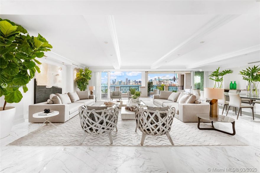 Entering this residence you are greeted by a tranquil private garden terrace w/fountain & views to S. Beach. The foyer leads to large living & dining areas w/flow-through layout & walls of glass extending to a grand bayside terrace w/ unobstructed views to Biscayne bay & Downtown skyline. The contemporary, fully renovated 4BR/4+2BA Bayview home boasts 6300 SF, custom design finishes & exquisite Thassos marble floors. A gourmet kitchen sports top-of-the-line appliances, Allmilmö cabinetry/granite Center Island. The sumptuous master suite features step-out terrace access w/bay views, his/her master bath w/sunken spa tub, steam shower & voluminous his/her walk-in closets. 3 car-parking spaces in underground garage plus 2 golf cart spaces, and one new Garia golf cart included with this sale.