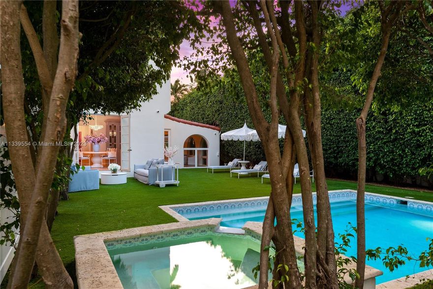 Stunning Mediterranean remodel in the heart of Miami Beach. The main house and guest house rebuilt from the studs using the finest materials under the guidance of one of Italy's most in-demand designer. The Feng Shui energy of the main house is immediately felt walking into the arched ceiling foyer. Vaulted ceiling and marble fireplace add warmth to the cozy living room. Abundant natural light beams throughout the house accenting rich tones of the herringbone wood and Calcutta stone found throughout the Chef's kitchen. Upstairs, master bedroom sits off of a dream closet, leading past the marble soaked master bathroom. Guest house includes 3 bedrooms /1 bath, gym and steam. Cabana bath located off of the Gunite pool/hot tub. European tea garden is perfect for entertaining