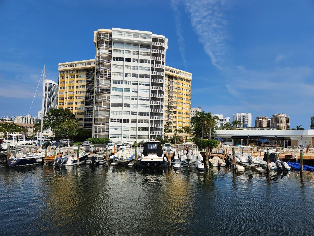 Lowest priced unit in building. Handy man special! Large one bedroom one and a half bath waterfront condo in a gated community overlooking the intracoastal waterway. Boat access and private waterfront with 24 hr security. Boat slip on a waiting list. BBQ grills, sauna, heated pool and many more. No lease first 2 years of ownership. SELLER HAS PAID ASSESSMENT IN FULL. Motivated seller!