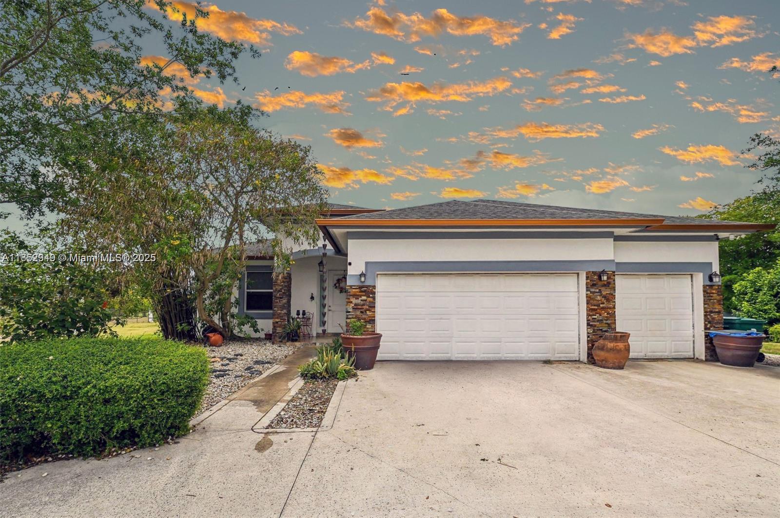 NO HOA NO RESTRICTIOINS Experience peace and privacy in this custom 4-bed, 3-bath home on 1.26 acres in Redland. Built in 2017, it features marble and tile floors, impact windows, a spacious split-bedroom layout, and an open kitchen with stainless steel appliances. The large primary suite includes a sitting area, a soaking tub, and a walk-in shower. Enjoy a 3-car garage, circular driveway, RV/boat parking, and an electric gate. No HOA, zoned agricultural—ideal for a homestead or hobby farm. Room for a pool, garden, or entertaining space!