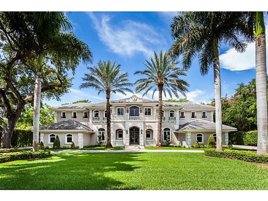 Situated on over an acre this gated Pinecrest estate is a masterpiece! This home boasts a grand foyer with stunning staircase, formal living room with 2-story ceilings and a fireplace, formal dining room, 1000 bottle wine cellar, and eat-in chef's kitchen . Enjoy movie night in the custom-built movie theater complete with 12 leather recliners, 160-inch movie screen, and state of the art equipment. The large yard includes a covered patio with a summer kitchen, blue tiled pool, and half basketball court.