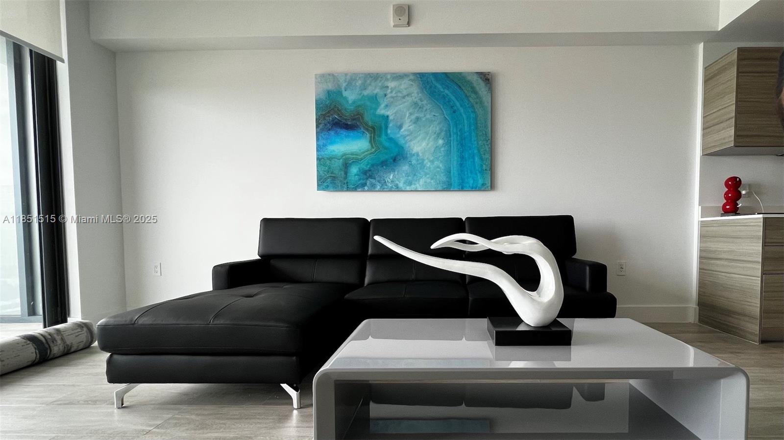 AWESOME way to enjoy Midtown lifestyle by renting this Fully FURNISHED LUXURY HYDE Condo with 1 Bed + Den and 1.5 Bath. Amazing Water and City views to enjoy from Living and Bedroom. Relax in spacious balcony with mesmerizing views that also provides a lots of natural light. Building includes resort style amenities like ROOF TOP Bar/Restaurant, Heated Pool, Tennis court, Mini golf, Spa, Fitness Center, Club Room, Business center, Media Room, Kids Room, Game Room, Valley parking and an inviting lobby with front desk and Security. Basic cable, Internet, Water & Sewer, included in the rent. Close to South Beach, Brickell/Downtown and lots of nearby Dining and Shopping in Midtown and Design district. Unit includes Washer-dryer and Walk In closet.