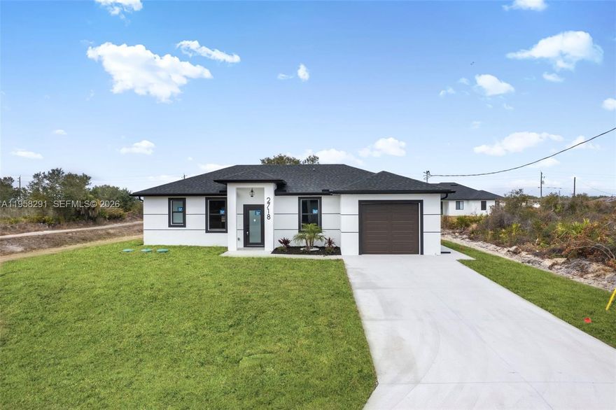 Seller is motivated and ready to make a deal! 10 Year Structural Warranty and 3% seller credit toward buyer’s closing costs with full-price offer. 100% completed and ready to move-in. Be sure to click on the 3D virtual tour! This beautifully designed new construction home sits on a corner lot and offers a modern living space. Featuring 3 bedrooms, 2 bathrooms, and a 1-car garage, the home includes 10-ft ceilings, hurricane-impact windows and doors, and washer/dryer installed in a separate laundry room. Enjoy 32x32 porcelain tile flooring throughout, high-profile baseboards, and a spacious kitchen with custom cabinetry, quartz countertops, and a full suite of Samsung stainless-steel appliances. Bathrooms showcase quartz finishes, glass shower doors, and premium fixtures. The property also includes a full irrigation system. Surrounded by new homes this residence combines style, quality, and value. Don’t miss your chance!