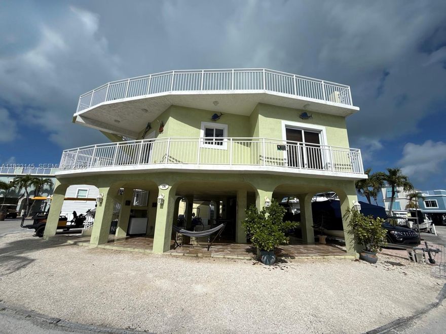 Charming 3BR 2BA home in a sought after Florida Keys community! Enjoy resort style amenities, pool, tennis court, private beach, gym, kids' splash pool, and marina with boat ramp to enjoy easy access to open waters. On site gas pump for boats and jet skis and boat slips for rent. The community also features a tiki area perfect for relaxing or fishing. Home offers bright, open living and plenty of parking for cars and your boat. Live the Keys lifestyle today!
