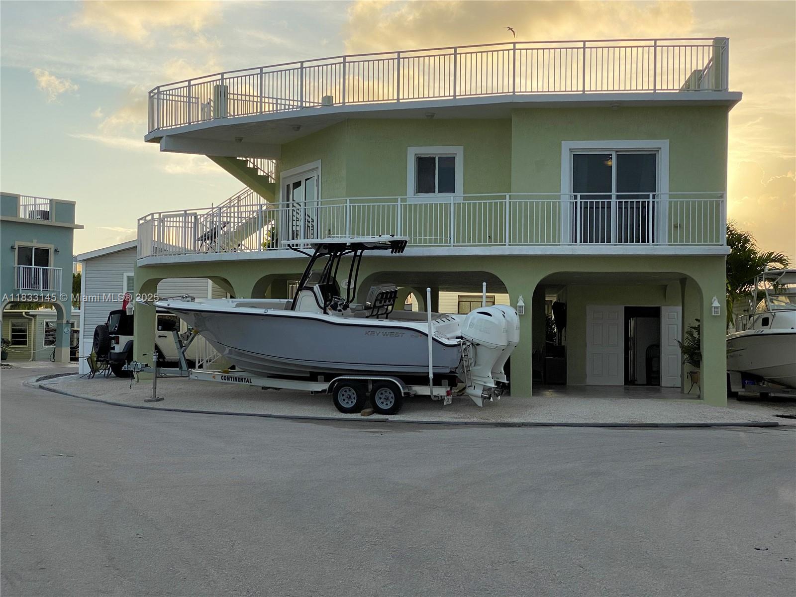 Charming 3BR 2BA home in a sought after Florida Keys community! Enjoy resort style amenities, pool, tennis court, private beach, gym, kids' splash pool, and marina with boat ramp to enjoy easy access to open waters. On site gas pump for boats and jet skis and boat slips for rent. The community also features a tiki area perfect for relaxing or fishing. Home offers bright, open living and plenty of parking for cars and your boat. Live the Keys lifestyle today!