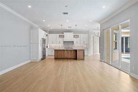 Photo of 248 Honeysuckle Dr, Jupiter, FL 33458 (MLS # A11784136)