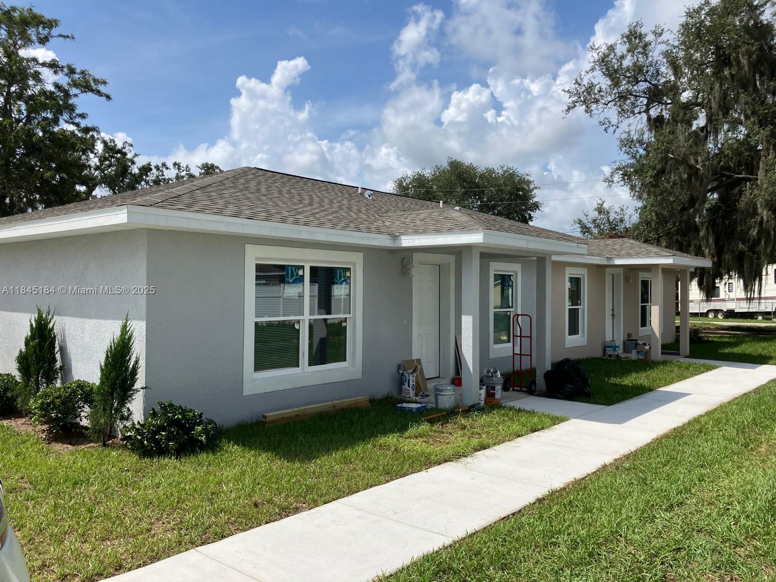 New Construction concrete block home 3 bed 2 bath, parking for 3 cars. Walking distance to downtown Sebring 'The Circle', amenities and local services. Blinds in every room, walk-in closet, brand new appliances including washing machine, dryer, oven range, microwave, fridge freezer with ice maker, dishwasher. Landscaped frontage, and large backyard. Pets welcome. High quality vinyl flooring, high quality kitchen cupboards and quartz worktops. Ceiling fans in every room. Sebring Florida is the home to the famous International Sebring Raceway. Close to amenities, restaurants, hospitals, grocery stores, a choice of lakes for fishing and water sports. Florida Sun.