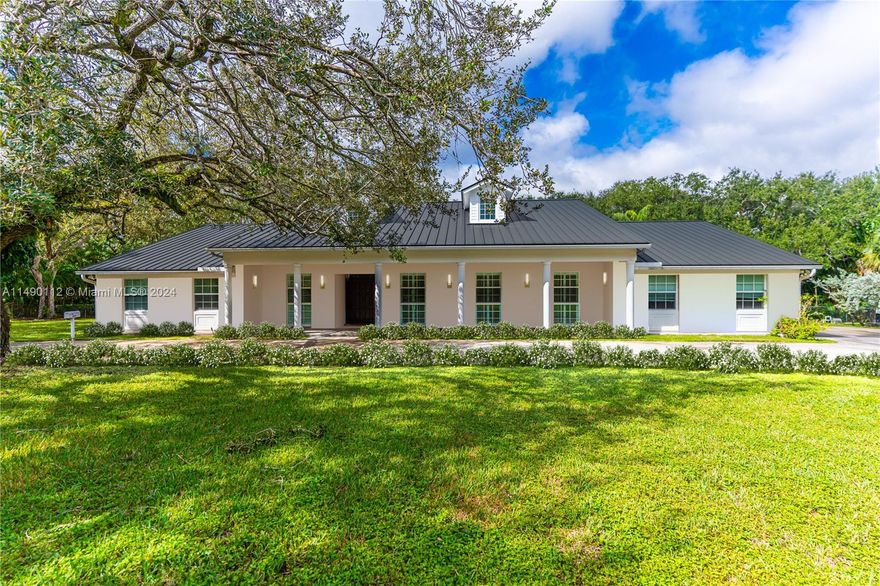 Nestled in the prestigious Snapper Creek Lakes guard gated community, this lovely two-story home completely re-built in 2009 offers a blend of elegance and comfort. The grandeur of tall ceilings and expansive windows flood the interior with natural light, creating a warm and inviting atmosphere throughout. The main level presents a generous living space, complemented by a chef's kitchen and ample storage. Upstairs, the bedrooms provide a peaceful retreat, offering serene views of the surrounding 1.34 acre lot. Outside the enchanting waterfront setting offers lovely views of the pool, lake, and tree canopy. A community marina with private boat dockage and ramps, offers endless opportunities for leisurely water activities. Embrace the allure of lakeside living in Snapper Creek Lakes.