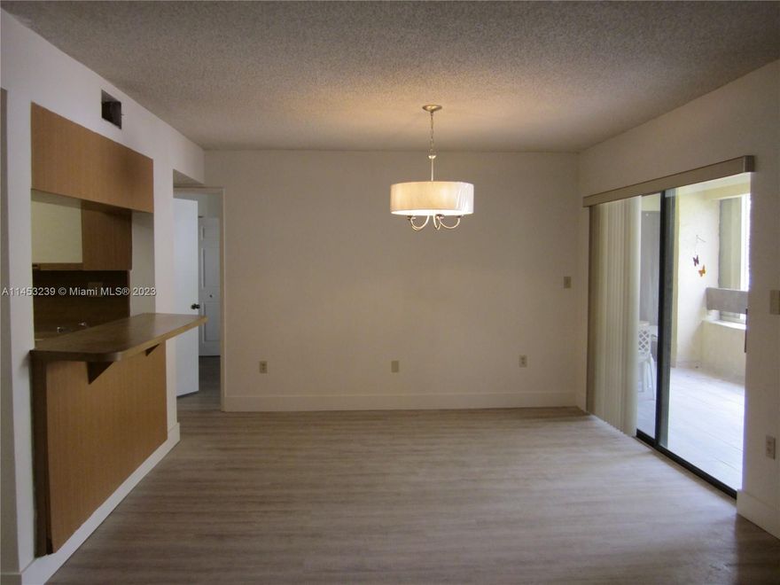 Beautifully updated and spacious 1 Bedroom, 1 1/2 baths condo in the Kenlands. Some of the features are large balcony with storage area, washer and dryer, new flooring throughout, updated bathrooms, new A/C, water heater and SS appliances. Gated building. Strolling pathways, pool, clubhouse and Tennis courts. Close to shopping, transportation and turnpike. No smoking or pets allowed.
