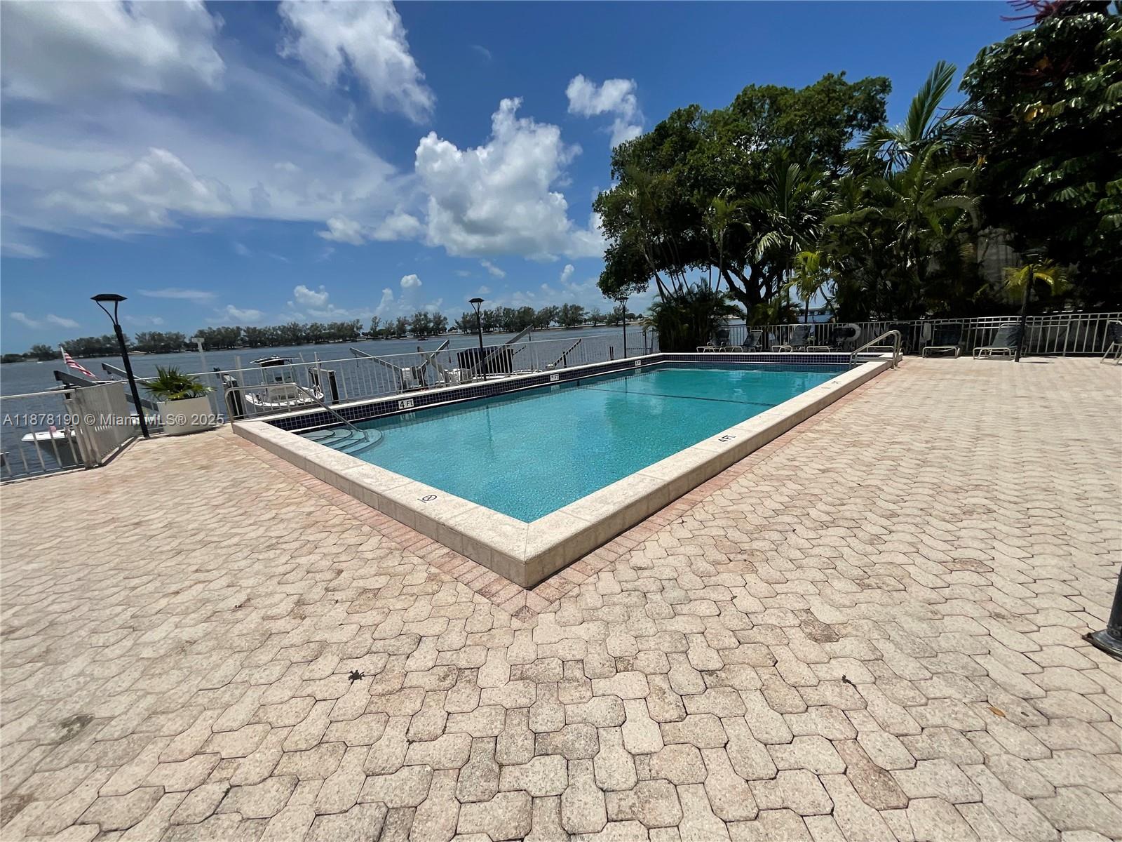 Just listed on Brickell Ave! Spacious 2-story condo with 1,350 sq ft. Main entry on 2nd floor with open kitchen, living/dining, balcony, plus 2 bedrooms & 1 bath. Lower level offers an additional bedroom, with sliding doors to side patio & full bath. Hurricane impact windows throughout. Building features a pool with bay views, 2 parking spaces (1 covered), bike racks, and gated security. Prime location near Brickell cafés, restaurants, banks, supermarkets & the Beaches! quick I-95 access.