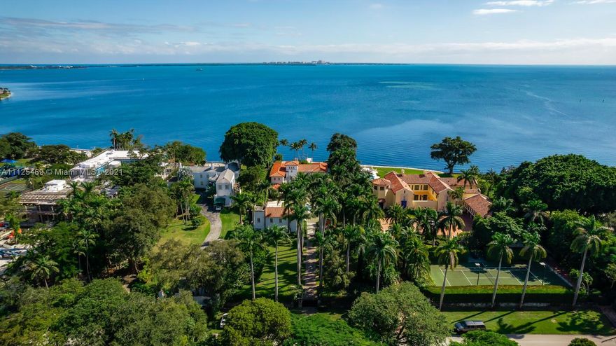Once in a lifetime opportunity to own a sprawling waterfront estate with a history that no one else can claim. Formerly owned by Madonna, the ultra-private gated residence sits on an oversized 51,000 sq.ft lot with 100 ft of water frontage. Showcasing breathtaking open bay views, this is one of only 6 waterfront homes in the exclusive enclave & the only one for sale with a dock. Interiors span 8,400 sq.ft with 9 beds & 8.5 baths, offering Mediterranean-style architecture with a grand coral staircase, spacious kitchen and great room with intricate millwork. Lush landscaping surrounds the grounds, an ideal setting to restore or build new. Nestled in one of Miami’s most desired locations, this property presents a secluded retreat next to famed Vizcaya, and minutes to Brickell & Miami Beach.