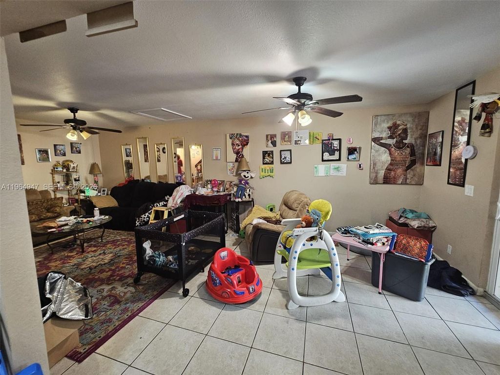 Photo of 5953 NW 24th Ct, Sunrise, FL 33313 (MLS # A11964947)