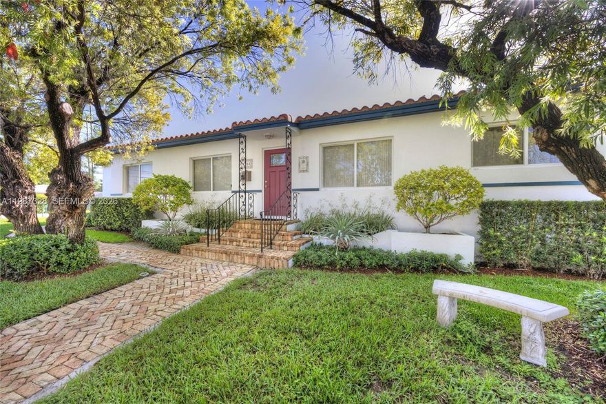 This charming 3 bedroom, 3 bathroom home is ideally nestled between Shenandoah, Silver Bluff & Coral Gate. Featuring original hardwood floors throughout & impact windows, the home blends timeless character with modern upgrades. Distinctive architectural details include elegant arched openings, custom niches, decorative ceiling accents & unique cut out archways that add warmth & charm. Situated on a desirable corner lot, the property offers ample space to add a pool & create your ideal outdoor retreat. Lovingly maintained by only its second owners for the past 30 years, the home is in excellent condition & ready for its next chapter. In addition,  there is a versatile den currently used as a home office, along with a convenient interior laundry room. A rare opportunity in a prime location.