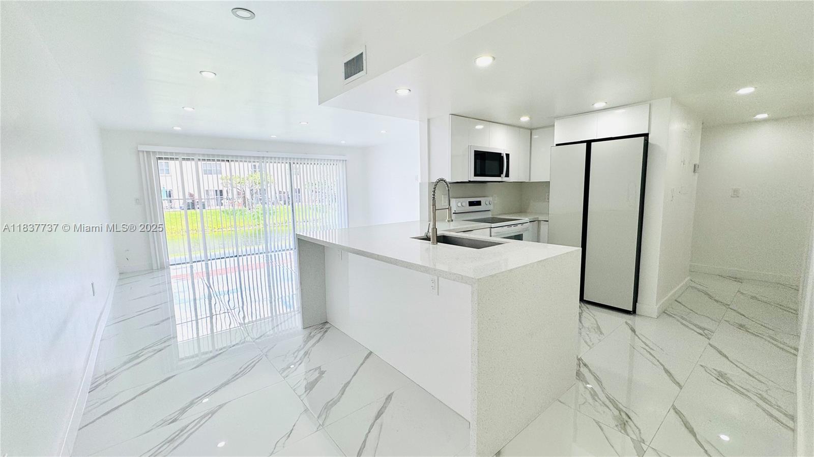 Discover this beautifully renovated first-floor apartment in the heart of Fontainebleau! Enjoy high-end finishes and elegant, sophisticated décor throughout. Relax with your morning coffee as you take in the serene lake views from the balcony. Located in a gated community with 24/7 security and constant surveillance, this home offers peace of mind and comfort. Fontainebleau is known for its central location, top schools, dining, shopping, and easy access to major highways. A perfect blend of luxury and convenience!