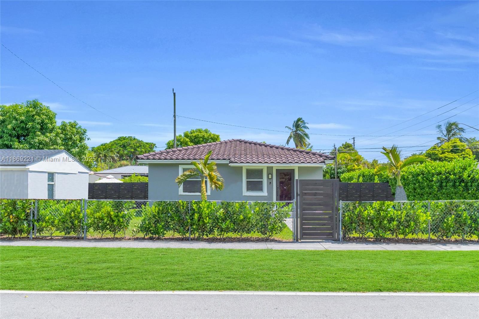 This beautifully renovated home showcases modern elegance with sleek porcelain floors, an open-concept layout, and a designer kitchen featuring quartz countertops, stainless steel appliances, and custom cabinetry. Natural light fills the spacious living areas, while the bathroom has been tastefully updated with luxury finishes. Outdoors, a private fenced yard with lush landscaping, a wood deck, and a covered patio create the perfect space for entertaining or relaxing. A detached garage-style structure offers additional storage or creative use, all in a prime location just minutes from Coral Gables, shopping, dining, and top-rated schools, making this residence the ideal blend of comfort, style, and convenience.