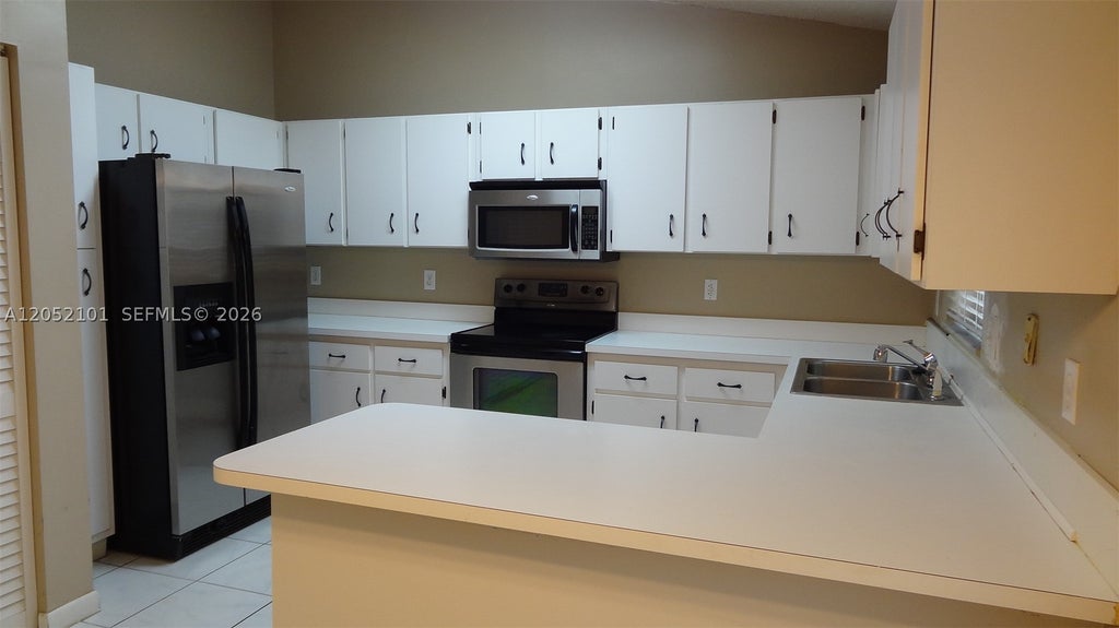 Photo of 12276 NW 36th Pl, Sunrise, FL 33323 (MLS # A12052101)