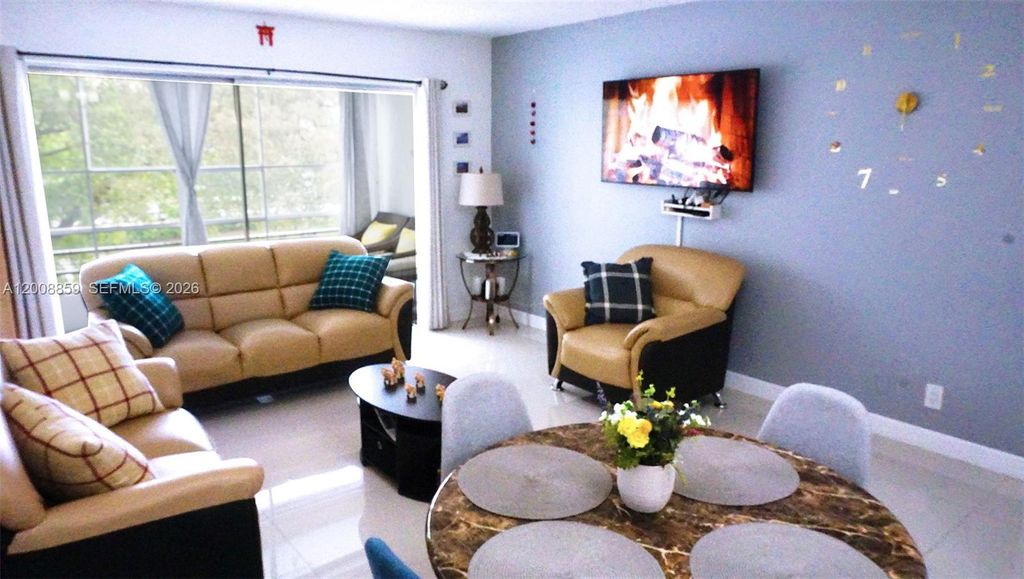 Photo of 8818 W Mcnab Rd #303, Tamarac, FL 33321 (MLS # A12008859)