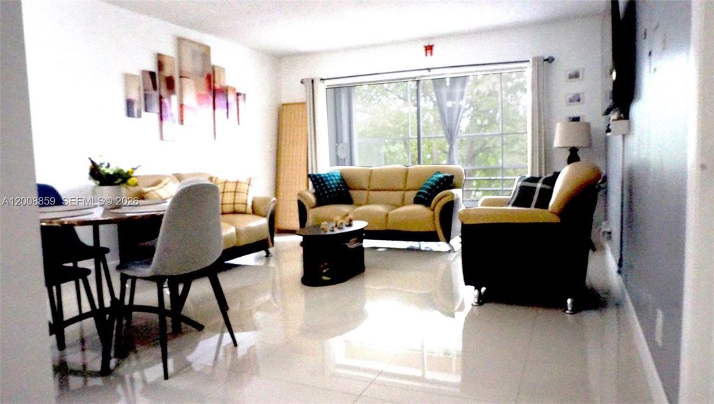 Photo of 8818 W Mcnab Rd #303, Tamarac, FL 33321 (MLS # A12008859)