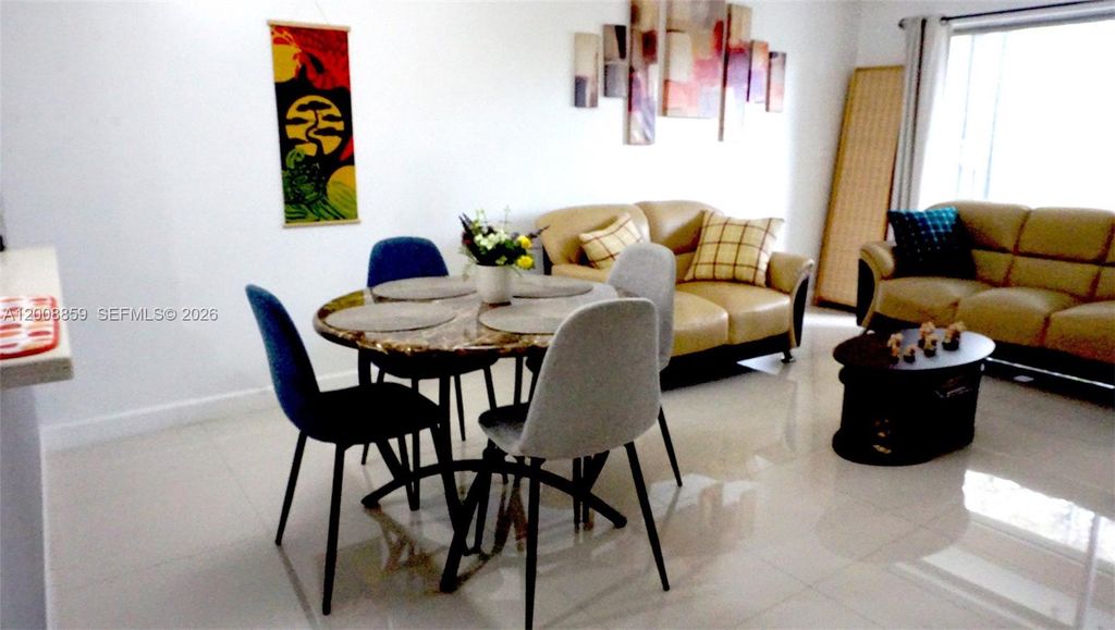 Photo of 8818 W Mcnab Rd #303, Tamarac, FL 33321 (MLS # A12008859)