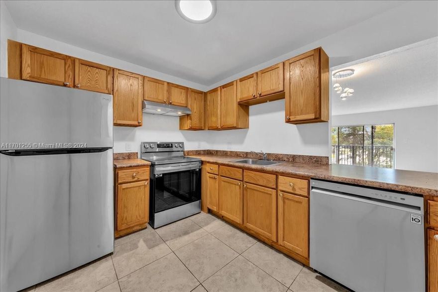 Well-maintained move-in ready 3 bedroom/2 bath corner unit at Village Square Condo. All ages welcome! This freshly painted unit features SS appliances, newer laminate flooring, ceramic tile, and W/D hookup inside. Enjoy a spacious living/dining area leading to a screened-in patio. The primary bedroom includes an en-suite bathroom and walk-in closet, while two guest bedrooms share a guest bathroom. Community amenities include a clubhouse, pool, basketball and tennis courts. Assessment until 2033 for patios, elevator, fire alarm, upcoming pool and clubhouse upgrades. HOA fee includes, water, trash, sewer and pest control. Centrally located near malls, restaurants, schools, medical facilities, and nearby beaches. No leasing first year of ownership. Motivated sellers, schedule a tour today!