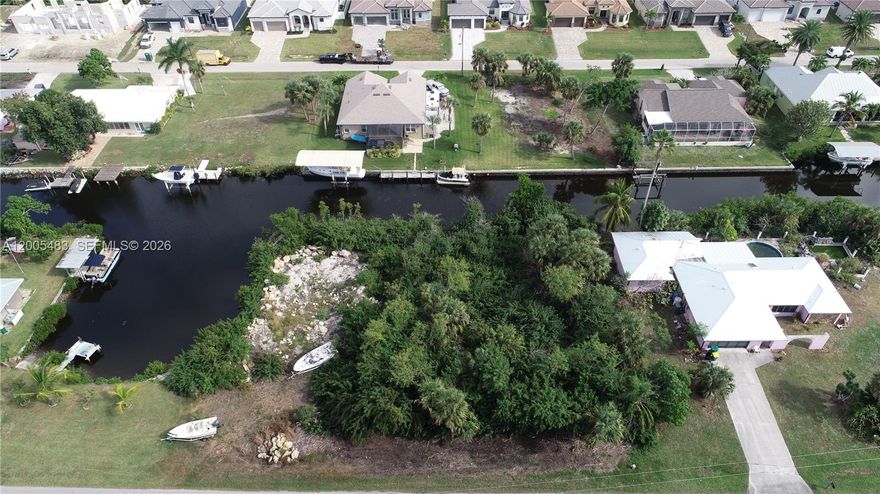 IMPRESSIVE PRICE FOR NAVIGABLE, SAILBOAT ACCESS WATER and NO BRIDGES! This property is situated on the Kostek Canal that brings you directly to Alligator Creek with direct access to Charlotte Harbor. Approximately 2.5 miles to Harbor. Deep water for heavy craft and Sailboats! The property has been mulched. Not located in Punta Gorda City Limits therefore no deed restrictions, no HOA and no CDD fees but you get all the amenities of water front living in Punta Gorda! READY TO BUILD YOUR DREAM HOME - prime residential lot build your dream home on this Sail Boat Property! Conveniently located near major highways, making it easy to travel to nearby beaches, golf courses, and other attractions. This lot provides the ideal blank canvas to bring your vision to life in one of Florida's most sought-after areas. Whether you're planning your forever home or a vacation retreat, investment ~ a great price point with minimal holding costs ~ this property is a must-see. Don't miss this incredible opportunity—schedule your showing today!