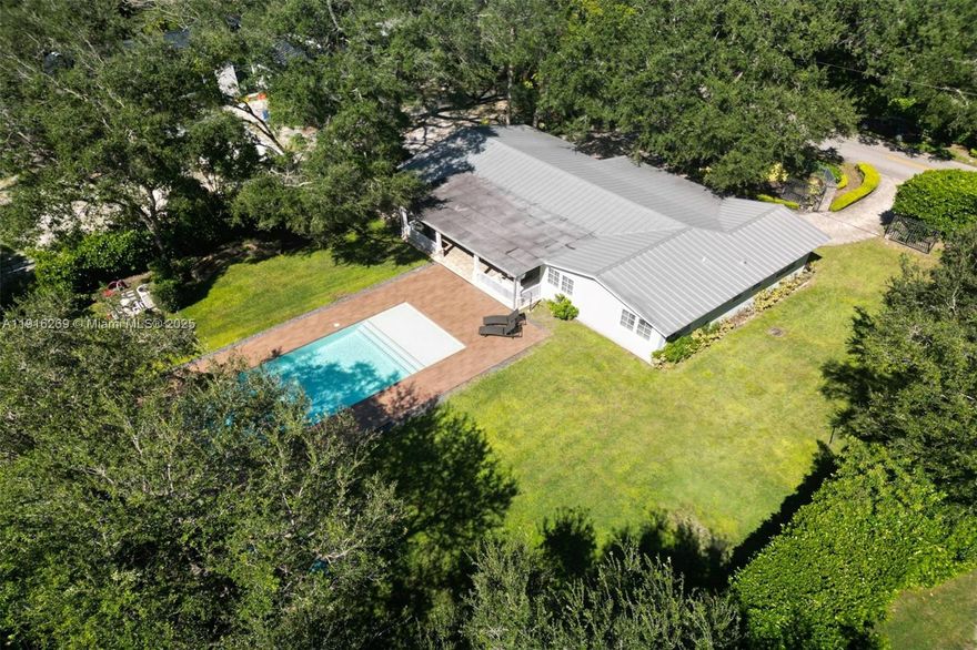 Rare opportunity to own nearly half an acre in the prestigious Ponce-Davis neighborhood—one of Miami’s most desirable and private residential enclaves. There is a charming one-story Key West–style home, three bedrooms, 2.5 baths, a metal roof, and a large swimming pool, surrounded by mature tropical. This corner property also offers endless possibilities—expand the current residence or rebuild a custom estate to match the caliber of the neighborhood. Enjoy tranquility and privacy just minutes from Coral Gables, South Miami, and top-rated schools.  Plans available.  Build with confidence a $15 million-plus estate.