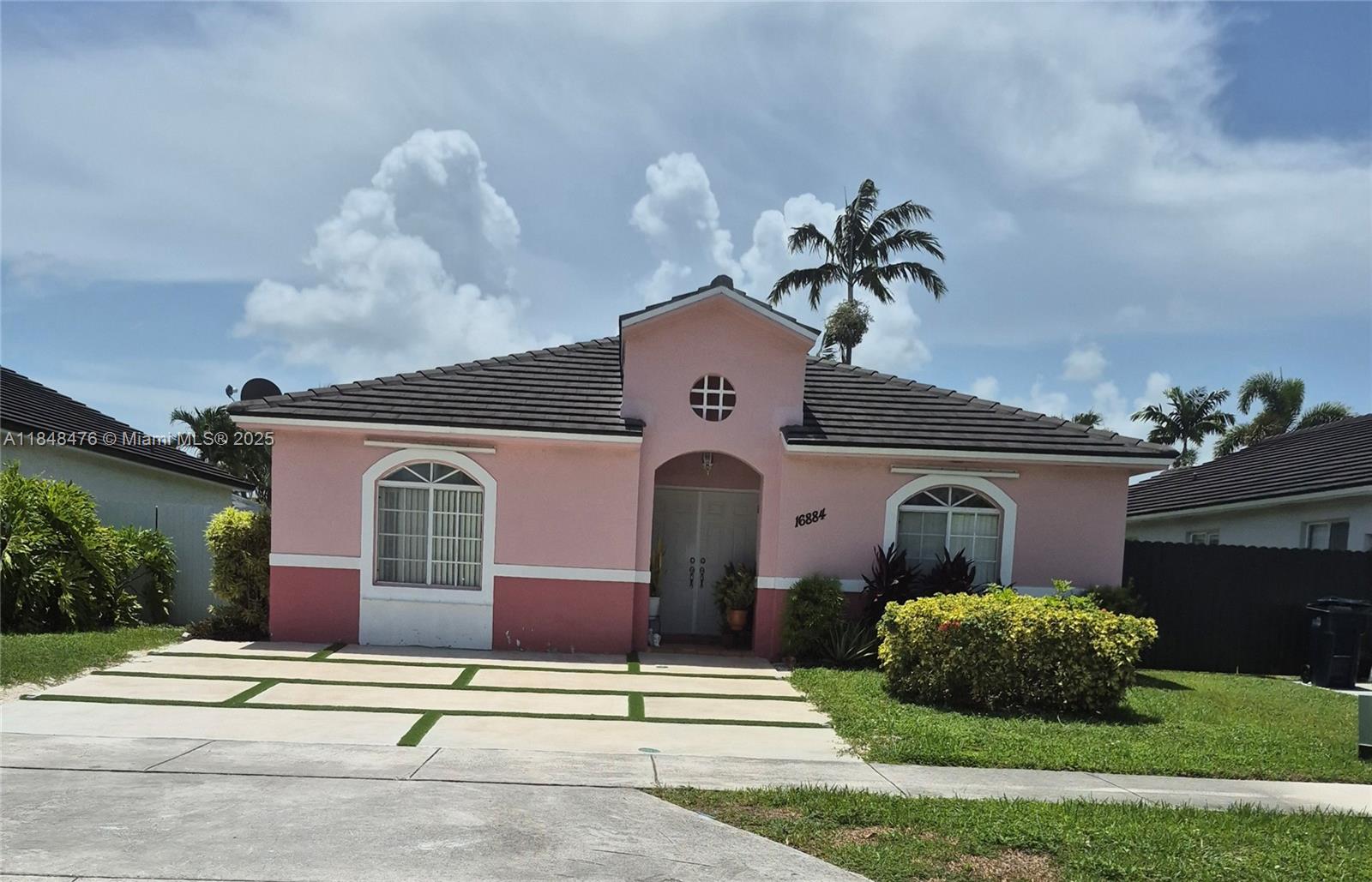 Discover the perfect blend of comfort and convenience in this charming 3- Bedroom 2 bathroom home nested in the heart of Miami. Maralex homes. Modern concrete and grass block driveway.
Private living room and dinning area. Separate kitchen and family room area to entertain your family and friends. Or sit in your own private gated back yard enjoying your mature fruit trees while enjoying a cup of coffee. This home has a utility room with washer and dryer. Laminate and Tiled flooring. No association
