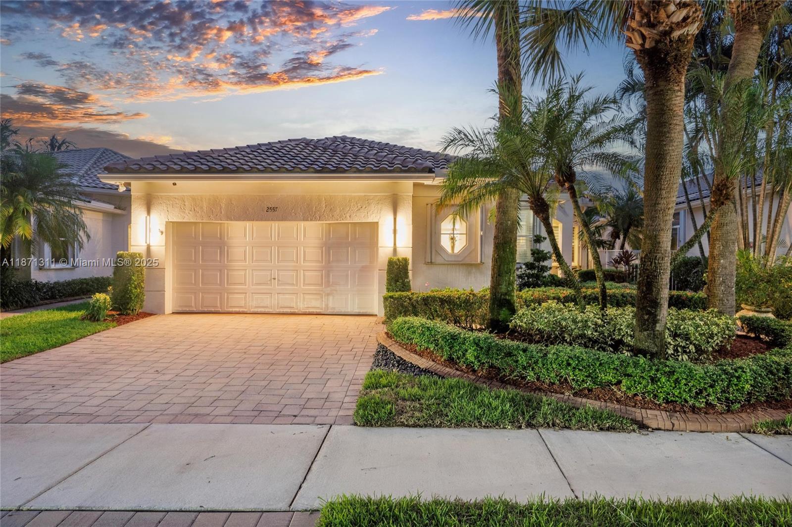 Beautiful lakefront home in Bay Pointe at gated Weston Hills. This 3 beds / 3 full baths one-story features a spacious open layout with 14’ ceilings and abundant light. Chef’s kitchen offers granite counters, stainless steel appliances, and built-in bar. Primary suite boasts 2 walk-in closets and a renovated bath with Maxx tub, walk-in shower, and dual vanities. Guest suite with private bath. Large laundry room. Other features: plantation shutters, LED lighting, accordion shutters, 2-car garage, custom cabinets, epoxy & EV charger. Screened patio, open terrace, fenced yard with room for a pool. Community covers lawn care, fertilization, pressure cleaning, & exterior painting. Roof 2024. Near I-75, dining, parks, and A+ schools. Mortgage savings may be available for buyers of this listing.