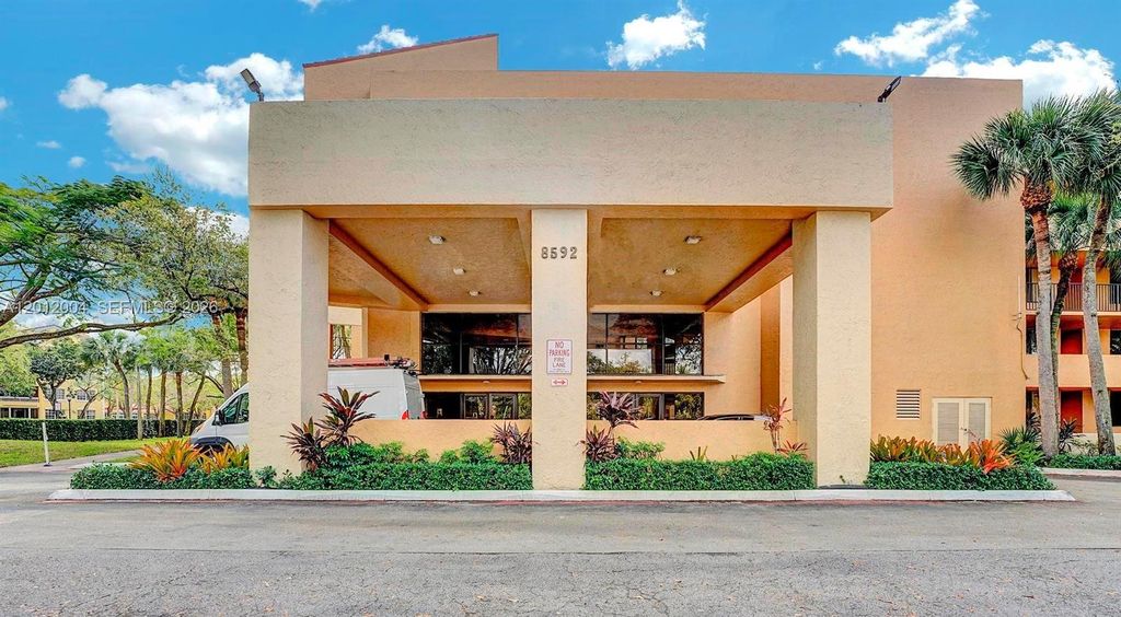 Photo of 8592 W Sunrise Blvd #408, Plantation, FL 33322 (MLS # A12012004)