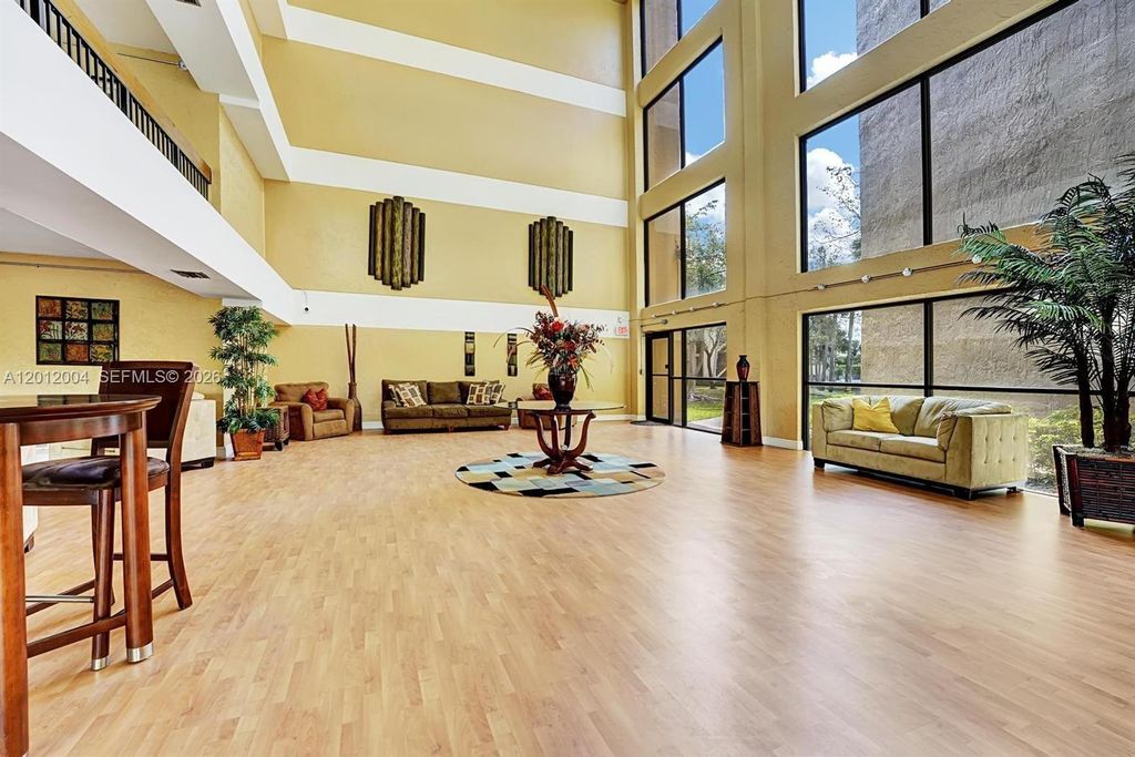 Photo of 8592 W Sunrise Blvd #408, Plantation, FL 33322 (MLS # A12012004)